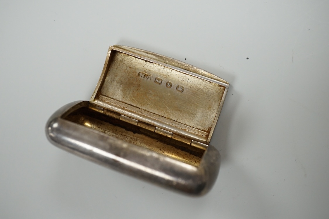 A late Victorian repousse silver navette shaped dish, by Charles Edwards, London, 1894, 25.7cm, with engraved monogram and date, together with a pair of mid 18th century silver sugar nips, an early 19th century silver vi